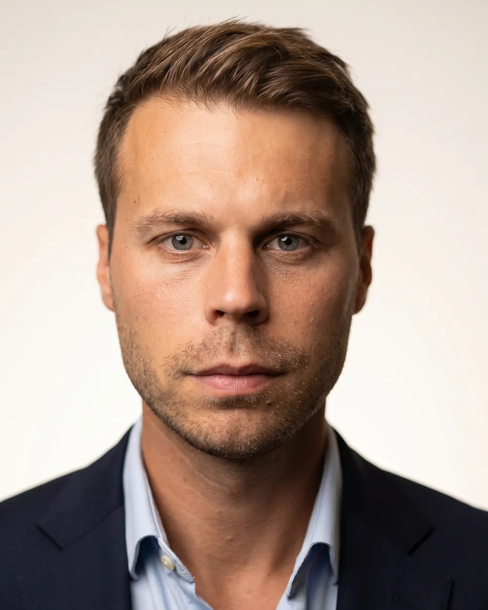 The finished professional headshot from Staffshots — even lighting, plain background
