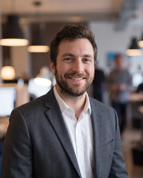 Professional headshot in one shared look, shown on an example team page as the account manager