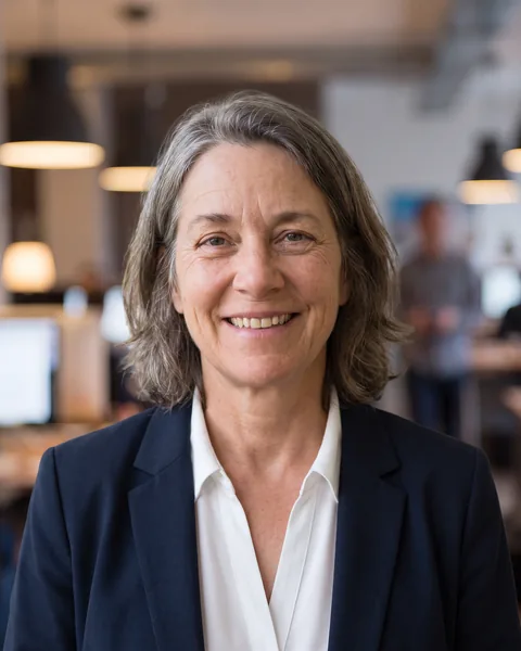Professional headshot in one shared look, shown on an example team page as the managing director