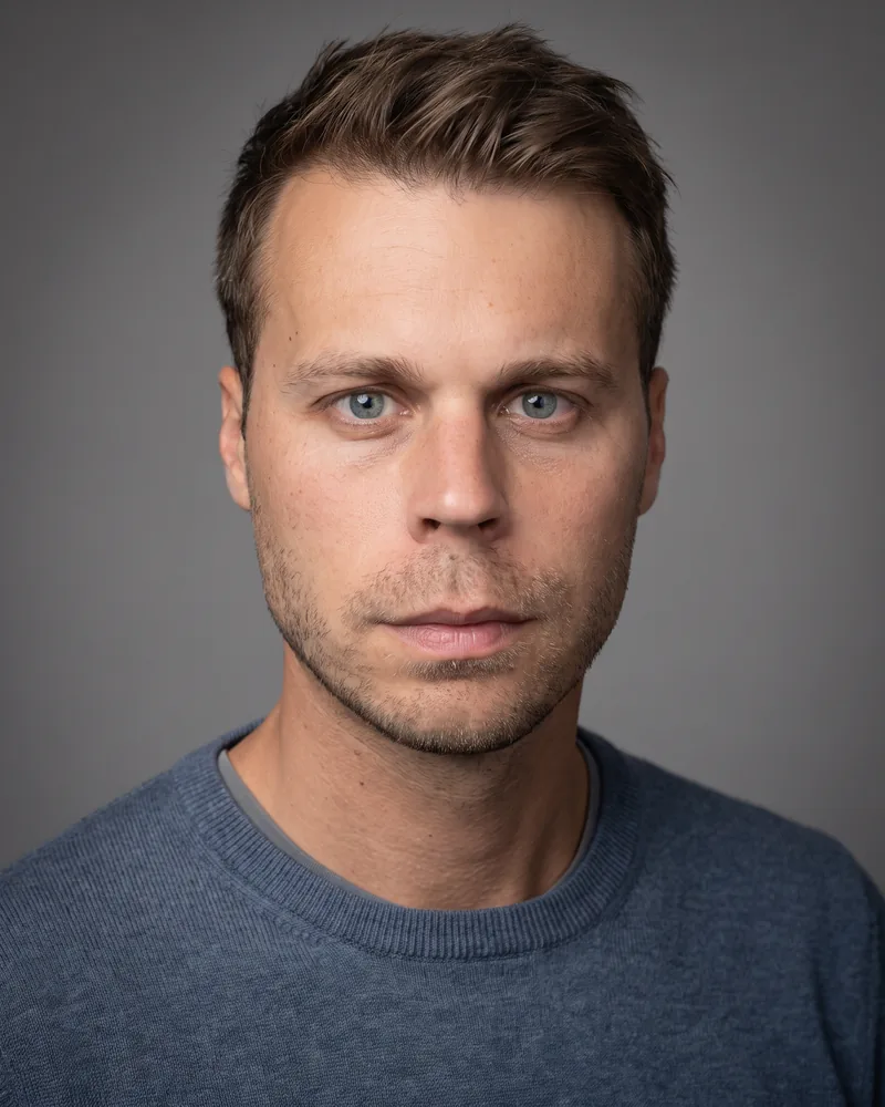 Professional headshot example generated by Staffshots — attire option: Merino knit, no jacket