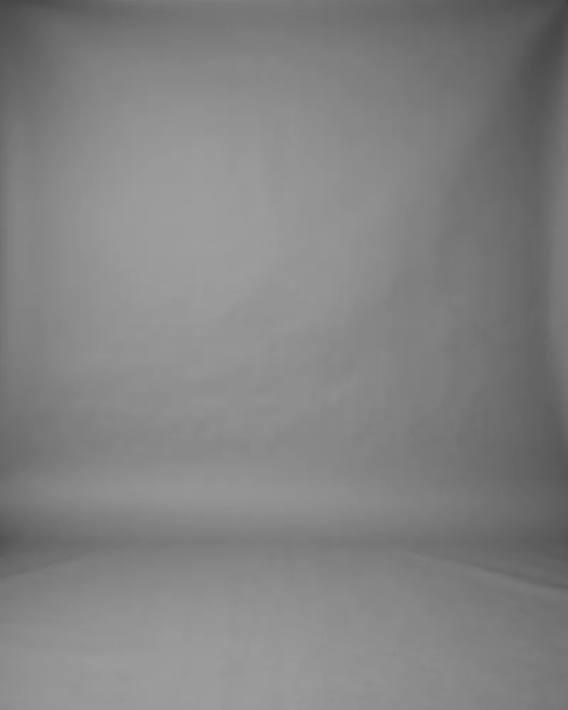 Professional headshot example generated by Staffshots — background option: Greyscale grey