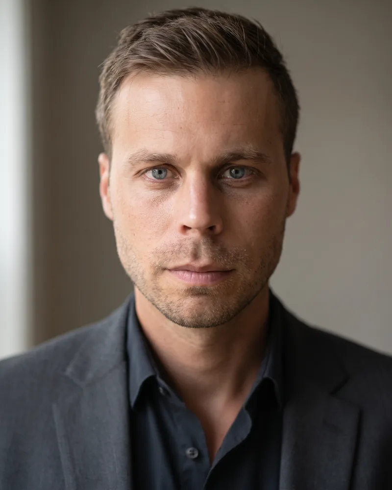 Professional headshot example generated by Staffshots in the Office Blur preset